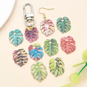 Detailed view of colorful monstera leaf DIY charm pendant and key chain accessories