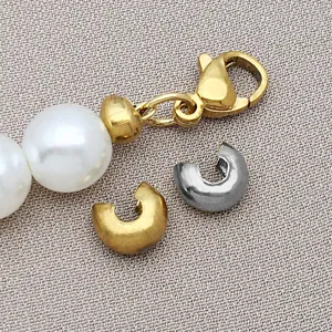 Detailed view of stainless steel C-shaped crimp cover bead tips for jewelry making