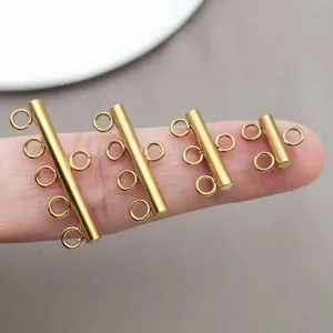 Goudkleurige roestvrijstalen meergats buisconnectoren voor DIY handgemaakte sieraden.