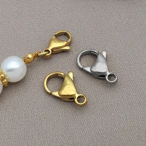 Close-up of stainless steel lobster clasps and pearl details for DIY jewelry making.