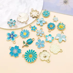 Assorted blue enamel flower and tulip alloy charms for DIY jewelry making accessories.