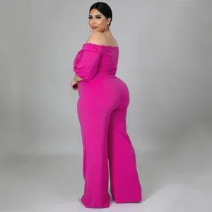 Detailed view of the stylish off-the-shoulder plus-size jumpsuit, showing the fit and pink fabric.