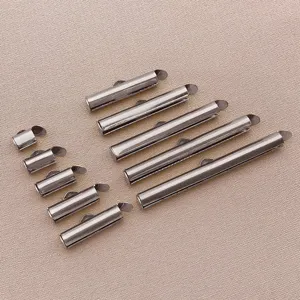 Detailed view of silver tone metal sliding tube clasps and connector pins for DIY jewelry making.