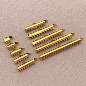 Detailed view of gold stainless steel slider tube clasps for DIY jewelry necklace making.