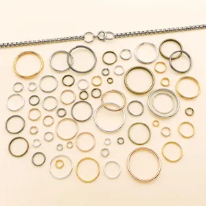 Close-up of mixed size metal split jump rings in six colors for DIY jewelry making and crafting.
