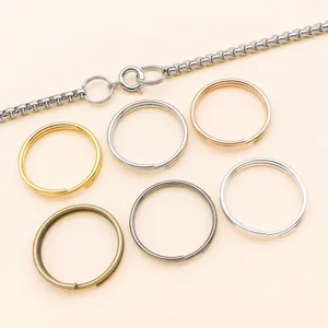 Multi-color metal split rings and chain DIY jewelry findings set, detail view for crafting.