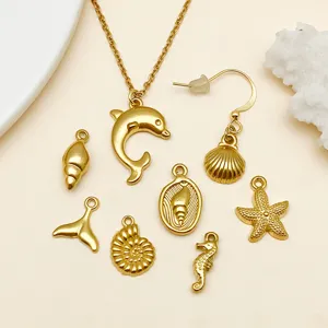 Gouden roestvrijstalen oceaan bedels set met dolfijn, schelp, zeester en zeepaardje hanger.