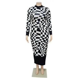 Close-up detail of women's black and white geometric printed long sleeve dress with contrast hem.