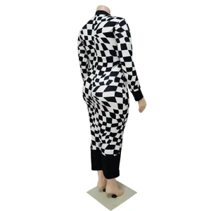 Detailed view of the black and white geometric print long sleeve dress showing unique pattern.