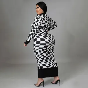 Detailed view of black and white checkerboard print long sleeve dress pattern and fabric.