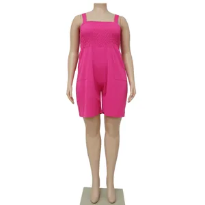 Close-up view of the bright pink plus size smocked romper showing the elastic bodice detail.