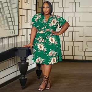 Plus size green floral wrap crop top and skirt set with V-neck and ruffle sleeves for women.