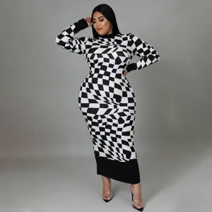 Detailed view showing the stylish black and white geometric checkerboard print on the dress fabric.