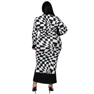Back detail of the long-sleeve black and white checkered dress showing fitted silhouette.