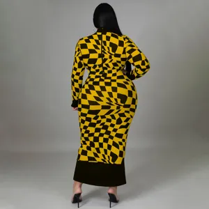 Close-up detail of the back view of the black and yellow checkered long sleeve maxi dress.