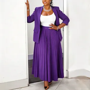 Women purple blazer and pleated maxi skirt set worn by model showing style and fit.