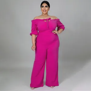 Plus size hot pink off-the-shoulder jumpsuit with front tie detail for women fashion.