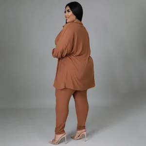 Detail view of plus size ribbed lounge set, comfortable long sleeve top and pants in brown.