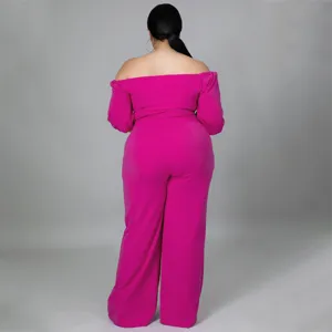 Back view details of plus size magenta off shoulder strapless jumpsuit showing elegant fit.