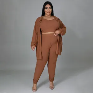 Ribbed plus size 3 piece casual outfit detail, comfortable crop top pants and matching shirt look.