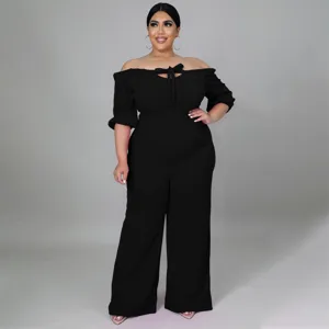 Detailed view of plus size black off-shoulder strapless jumpsuit with stylish front tie.