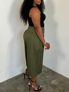Plus size casual wide leg pants featuring comfortable loose fit and pleated high waist.