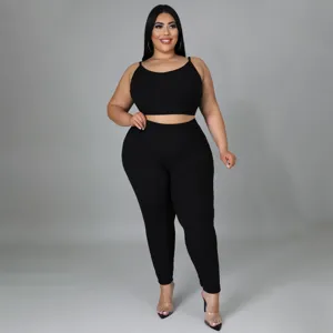 Plus size black ribbed two piece set detail, stylish sleeveless crop top and matching leggings.