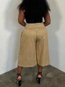 Detail view of casual loose pleated wide-leg pants in plus size, comfortable high waist.
