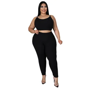 Detail view of the solid black plus-size two-piece crop top and leggings outfit.
