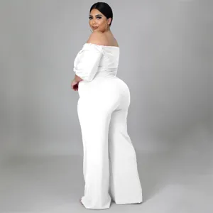 Plus size white off shoulder jumpsuit detail, puff sleeve strapless design, elegant party look.
