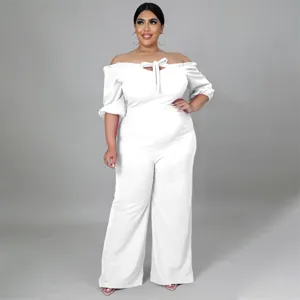 Plus size white off shoulder jumpsuit with tie front and wide legs for women fashion wear.