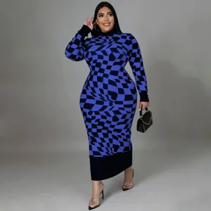 Close-up detail of the stylish blue and black geometric patterned long sleeve midi dress.