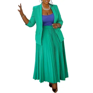 Detailed view of women elegant green blazer, blue camisole and pleated long skirt set.