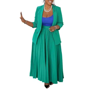 Green women blazer and pleated long skirt set with blue top, chic professional outfit.