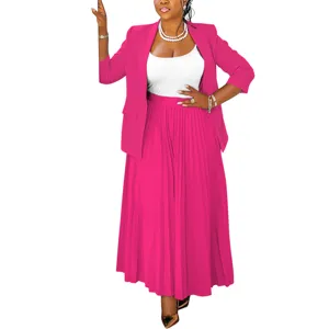 Pink blazer and pleated skirt detail view, elegant women's professional wear set.