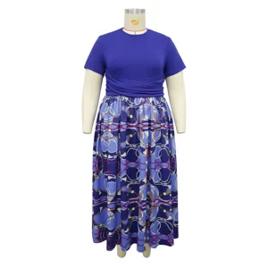 Plus size color block maxi dress featuring a solid blue top and chain printed pleated skirt.