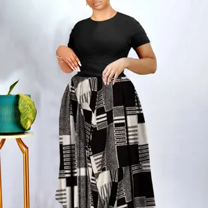 Detailed view showcasing the elegant pleated top and unique geometric print skirt design.