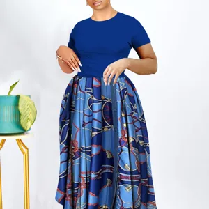 Detailed view of women's short-sleeve top and printed long skirt set, elegant plus size fashion dress.