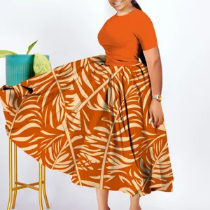 Detail view of a stunning plus size African style orange pleated maxi dress with elegant leaf print.