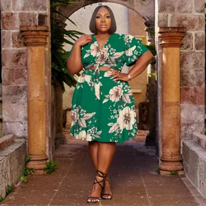Plus size green floral two piece dress with V-neck, tie front and ruffle sleeves for women.