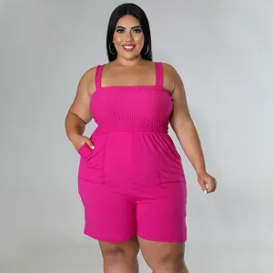Hot pink smocked romper detail featuring dual front pockets and comfortable straps.