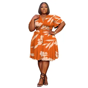 Close-up details of the orange floral two-piece set, featuring V-neck top and skirt.