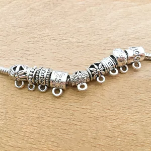 Antique silver DIY charm bracelet connector bead detail shot, metal large hole findings.