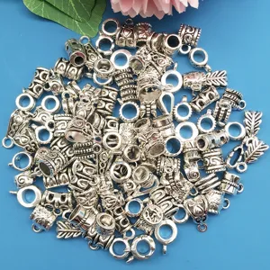Silver metal dreadlock beads and charms for hair braiding and DIY jewelry making findings.