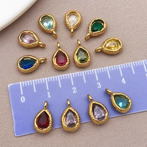 Detailed view of colorful teardrop gemstone charms for DIY jewelry making and crafting.