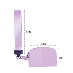Mini purple wrist bag detail view, showing convenient strap and compact size dimensions.