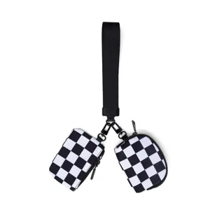 Black and white checkered wristlet coin purse and card holder with strap for daily use.