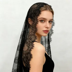 Detailed close-up of a black lace veil featuring delicate floral patterns and exquisite edge trim.