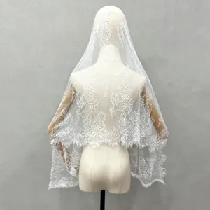 White lace bridal veil detail view, vintage fairy wedding hair accessory and photography prop.