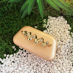 Exquisite matte finish box clutch featuring metallic wavy decor, elegant evening bag for party.